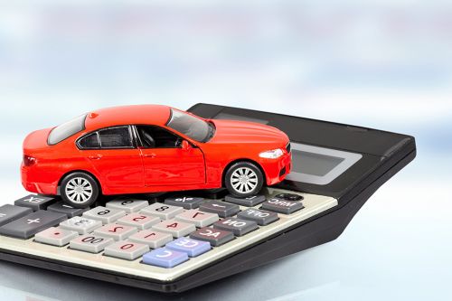 Foto: Modellauto auf Taschenrechner